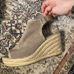 Never worn, size 8 1/2 beige wedges.